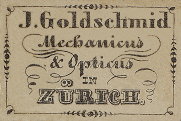 Alte Visitenkarte für "J. Goldschmidt Mechanicus & Optics in Zürich", likely aus dem frühen 20. Jahrhundert, die die Dienstleistungen des Unternehmens auflistet.