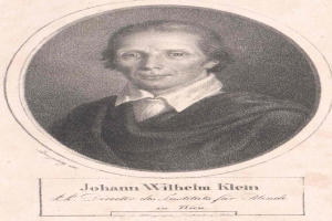 Schwarz-weißes Porträt von Johann Wilhelm Klein, Direktor des Instituts für Blinde in Wien, der einen weißen Hemd und einen ernsten Gesichtsausdruck trägt, mit deutschem Text unten.