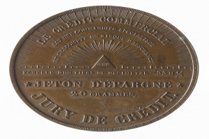 Bronzene Medaille mit der Aufschrift "Jury de Credit" vor weißem Hintergrund.