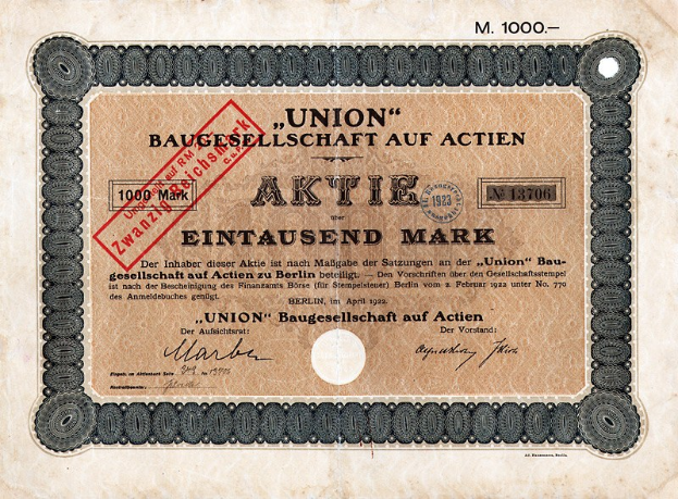 Alte deutsche Banknote mit rotem Stempel, die als Aktienzertifikat gekennzeichnet ist.