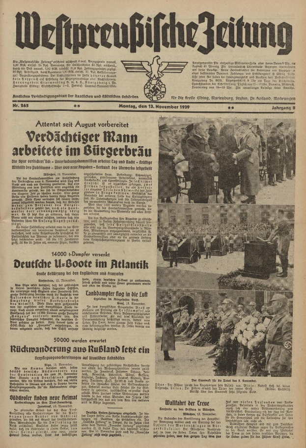 Schwarze und weiße Titelseite einer deutschen Zeitung vom 13. November 1939 mit der Überschrift "Weitpreubliche Zeitung", die eine Gruppe von Menschen in traditioneller deutscher Tracht in einer feierlichen Atmosphäre zeigt.