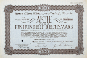 Ein altes deutsches Wertpapier mit schwarzem Rand und der Aufschrift "Aktie √ľber Einhundert Reichmark"